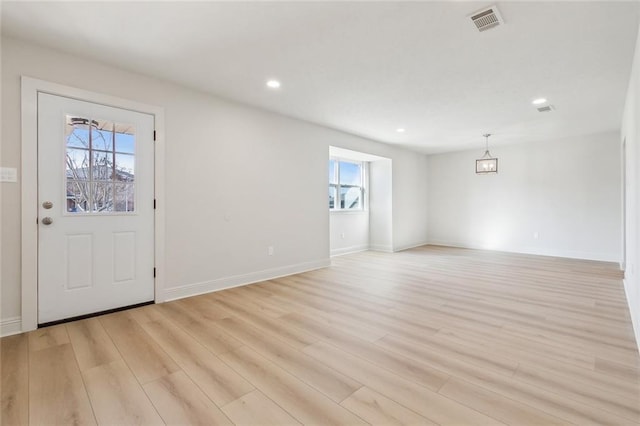 foyer entrance featuring visible vents, recessed lighting, light wood-type flooring, and baseboards