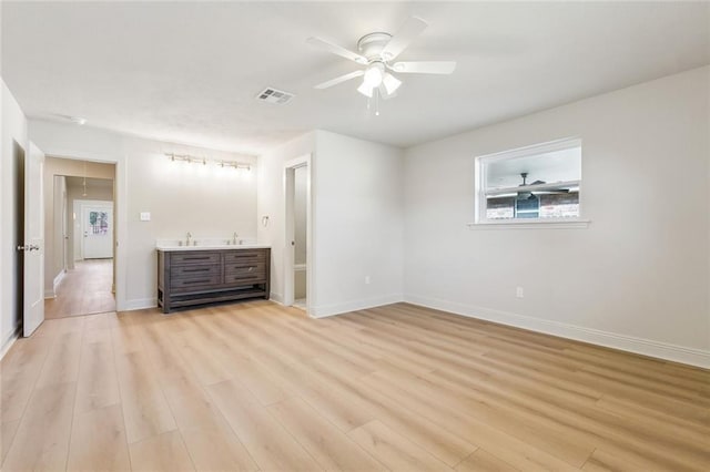 unfurnished bedroom with visible vents, baseboards, ceiling fan, and light wood finished floors