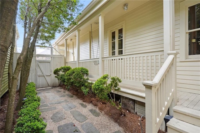 view of patio / terrace with a porch and a gate