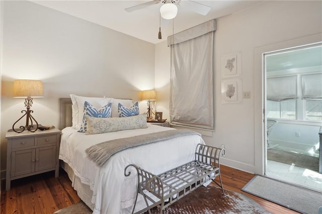 bedroom with ceiling fan, baseboards, and wood finished floors