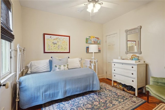 bedroom with a ceiling fan and wood finished floors