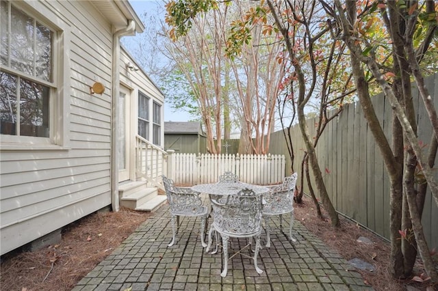 view of patio / terrace with entry steps and a fenced backyard