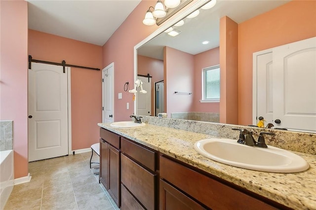 full bath featuring double vanity, baseboards, a garden tub, and a sink