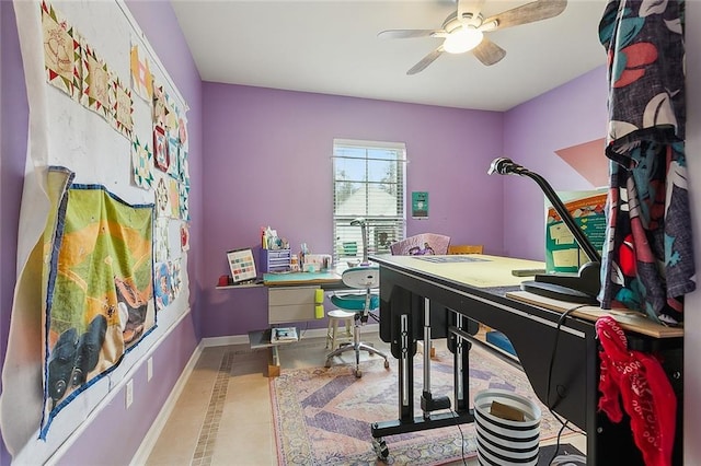 office featuring baseboards and ceiling fan