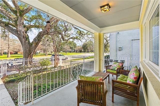 balcony featuring covered porch