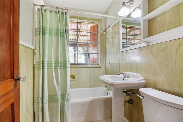 bathroom with toilet and shower / tub combo with curtain