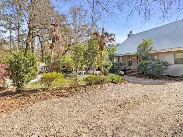 view of yard with covered porch