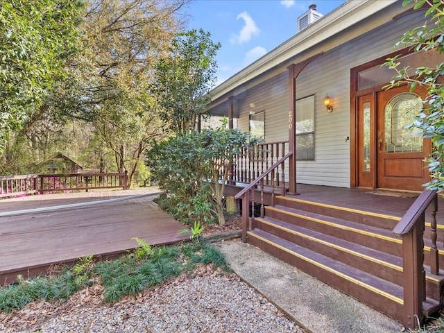 wooden terrace featuring covered porch