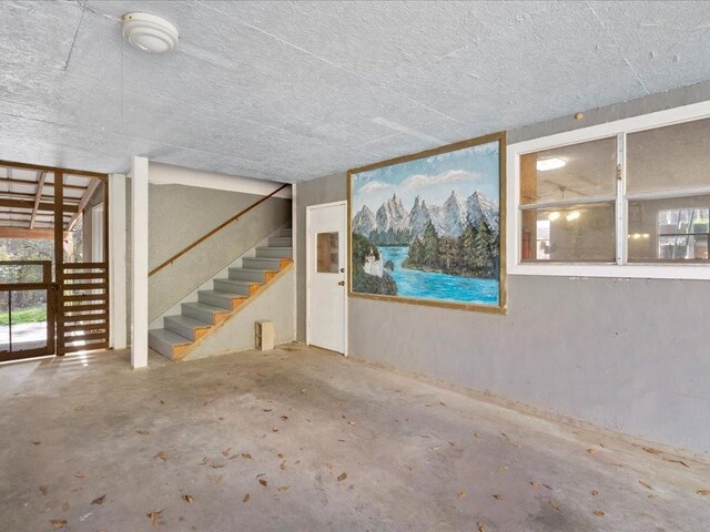 basement featuring stairs