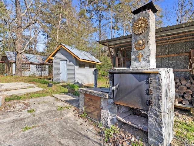 exterior space with an outbuilding and a shed