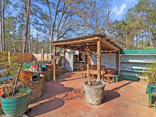 view of patio / terrace featuring fence