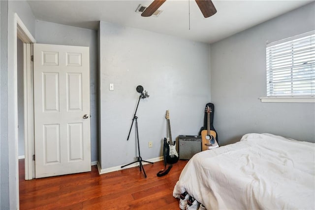 bedroom featuring wood finished floors and a ceiling fan