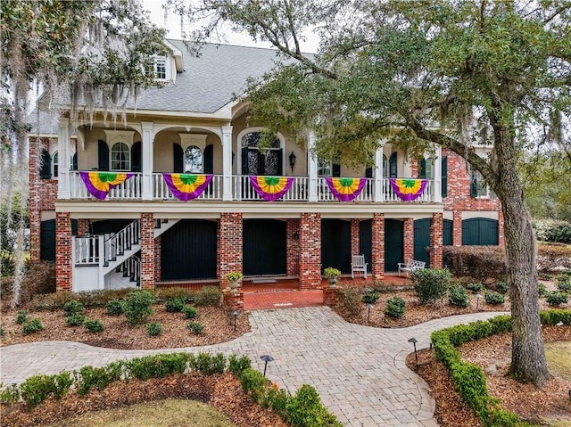 rear view of property with a porch