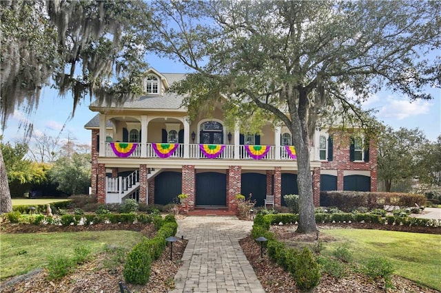 view of front of house featuring a front lawn and brick siding