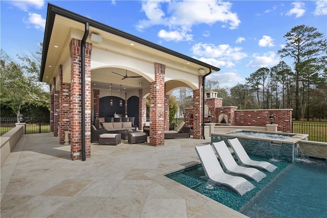 view of swimming pool featuring ceiling fan, fence, an outdoor living space with a fireplace, an in ground hot tub, and a patio