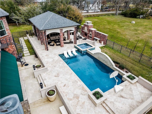 view of swimming pool with a lawn, a fenced backyard, a gazebo, a fireplace, and a patio area