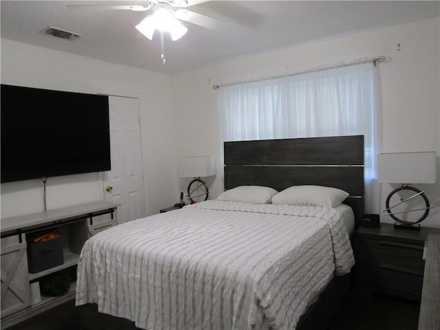 bedroom featuring a ceiling fan and visible vents