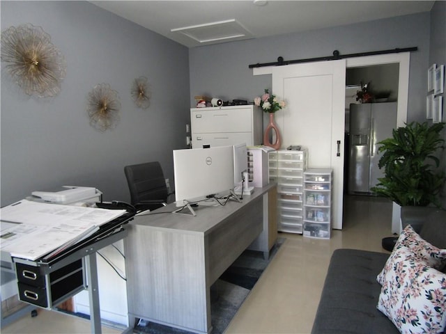 home office featuring a barn door