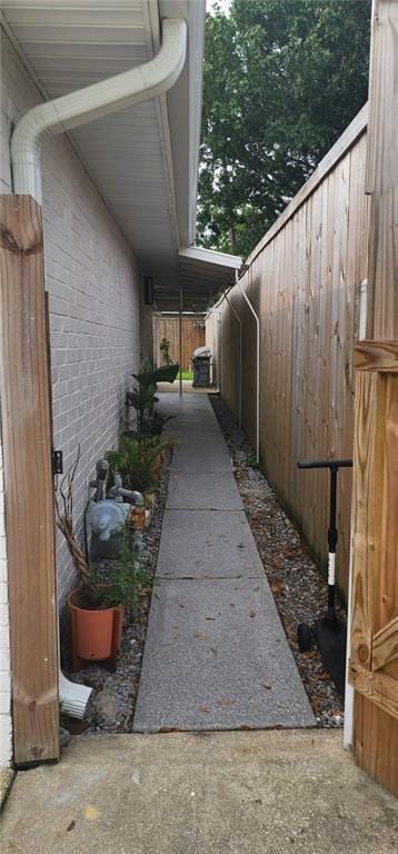 view of side of home with brick siding