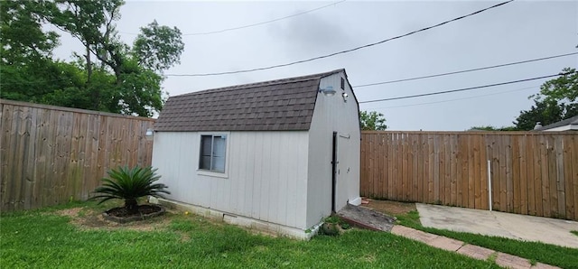 view of shed featuring a fenced backyard