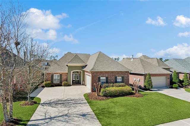 view of front of home with concrete driveway, a garage, brick siding, and a front lawn