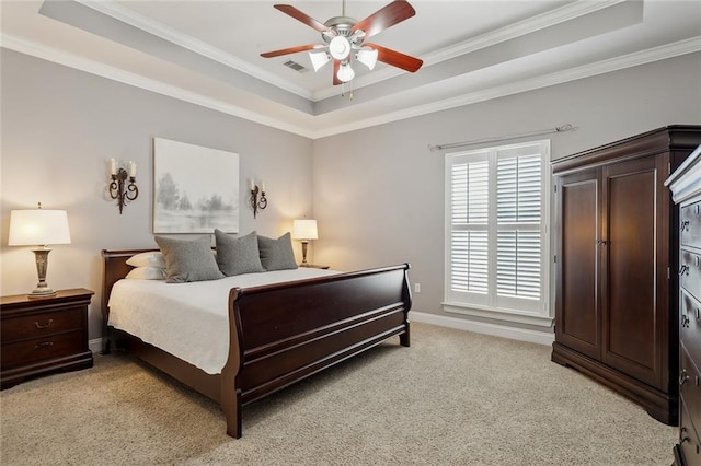 bedroom with baseboards, visible vents, ornamental molding, light carpet, and a raised ceiling