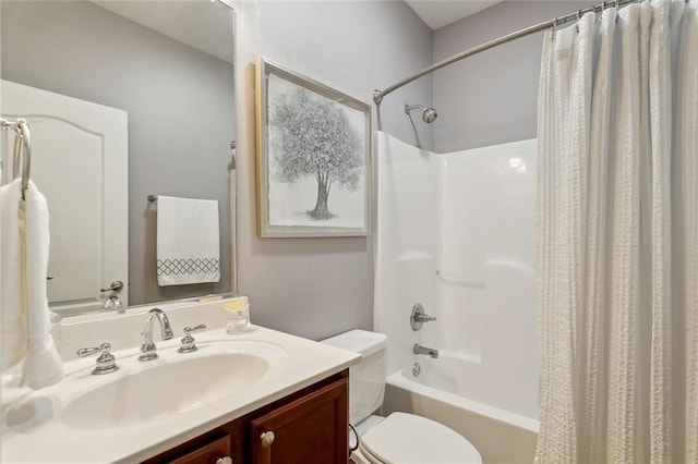 full bathroom with vanity, shower / tub combo, and toilet