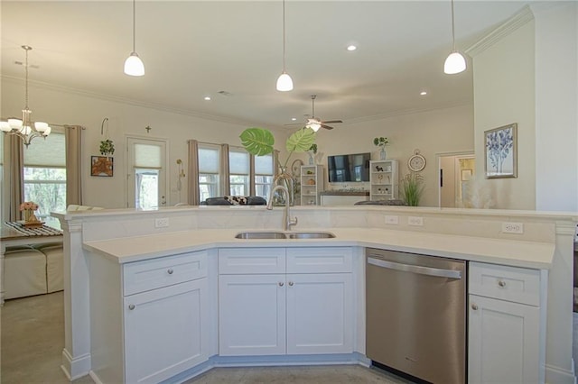 kitchen featuring ceiling fan with notable chandelier, a sink, stainless steel dishwasher, open floor plan, and crown molding