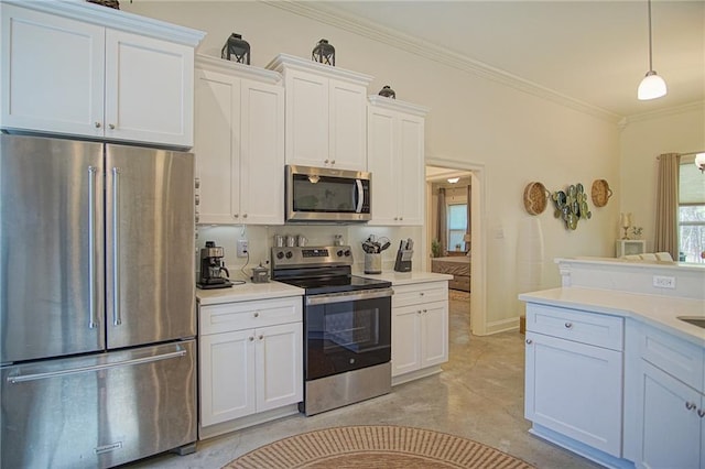 kitchen featuring white cabinets, appliances with stainless steel finishes, light countertops, and ornamental molding