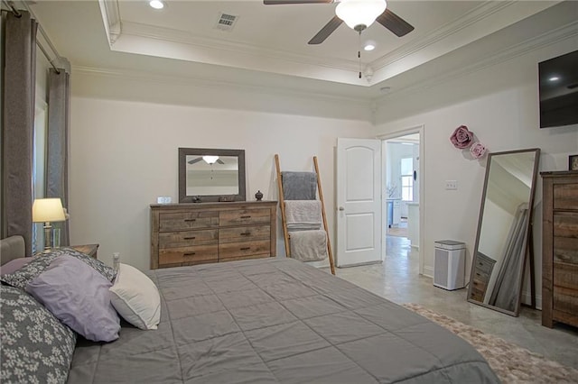 bedroom with a raised ceiling, crown molding, and visible vents