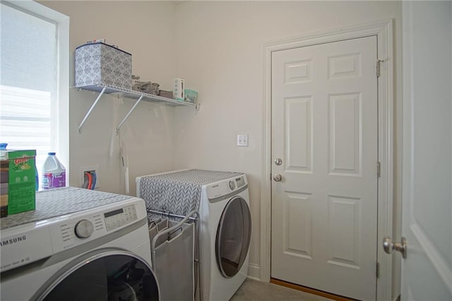 laundry area with laundry area and separate washer and dryer