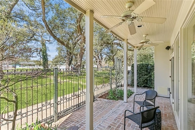 view of patio / terrace featuring a ceiling fan and fence