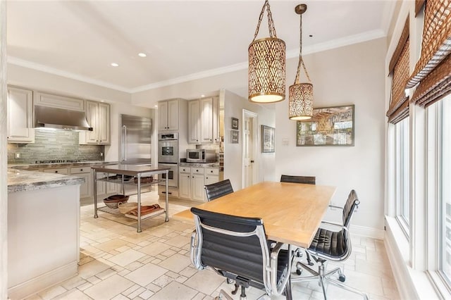 dining area with recessed lighting, baseboards, stone tile flooring, and ornamental molding