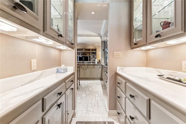 bathroom with stone finish flooring and vanity