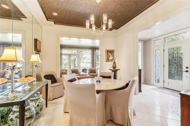 dining room featuring light tile patterned floors, an inviting chandelier, and crown molding