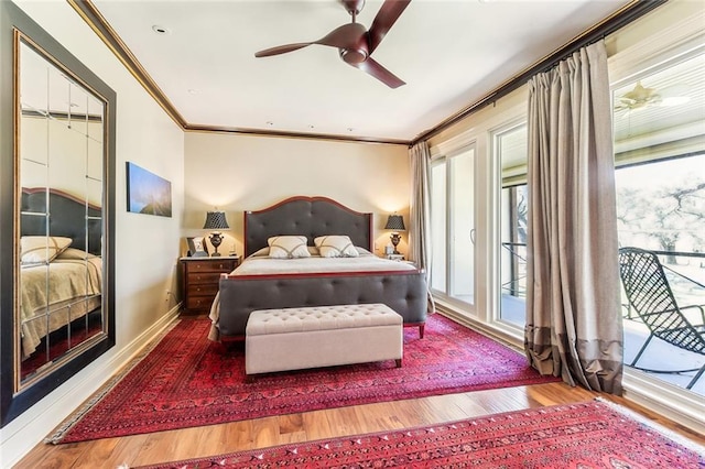 bedroom with access to exterior, wood finished floors, crown molding, baseboards, and ceiling fan