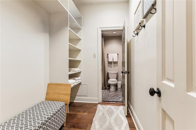 mudroom with baseboards and wood finished floors