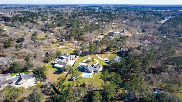 drone / aerial view featuring a forest view