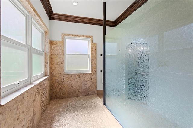 full bath with crown molding and tiled shower