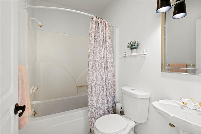 bathroom with toilet, shower / bathtub combination with curtain, and a sink