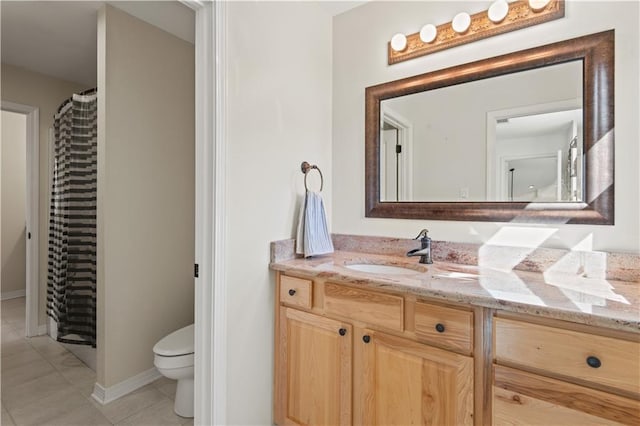 bathroom with toilet, curtained shower, tile patterned flooring, baseboards, and vanity