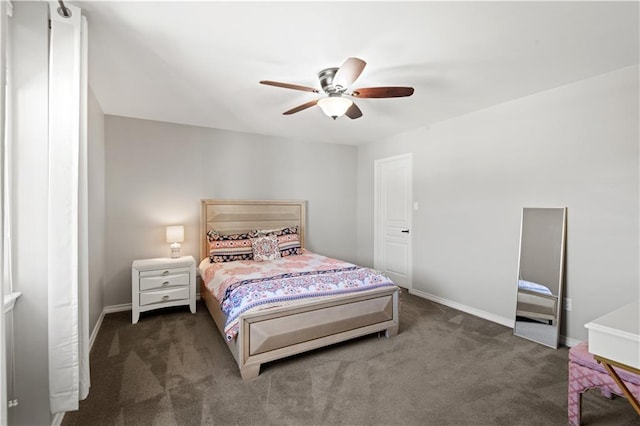 carpeted bedroom with baseboards and ceiling fan