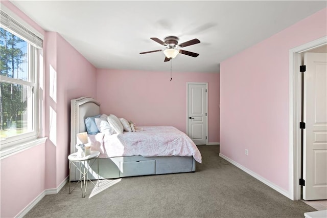 bedroom featuring baseboards, carpet, and ceiling fan