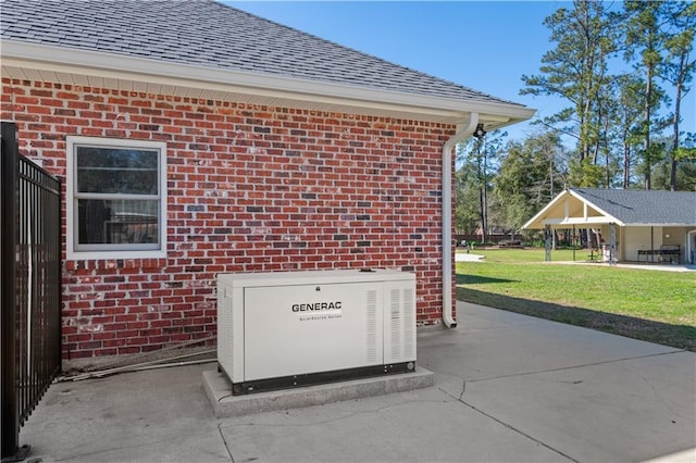 exterior space featuring a downspout, brick siding, a power unit, and gutters