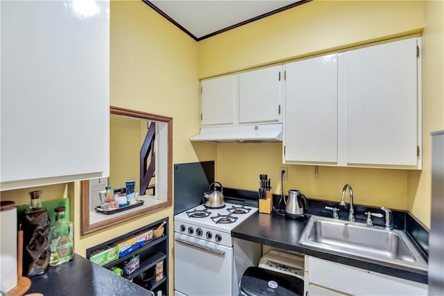 kitchen with under cabinet range hood, white range with gas cooktop, dark countertops, and a sink