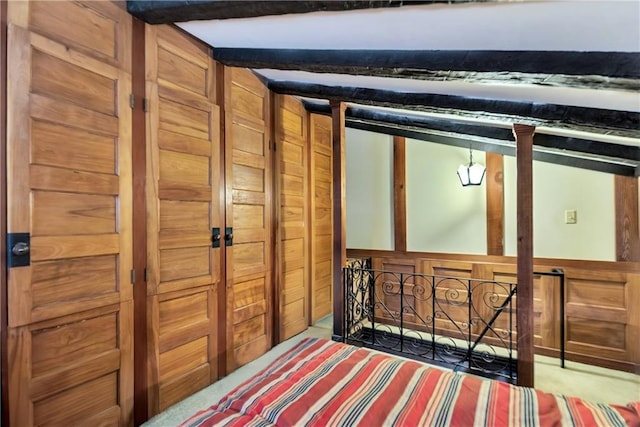 interior space with wooden walls and carpet