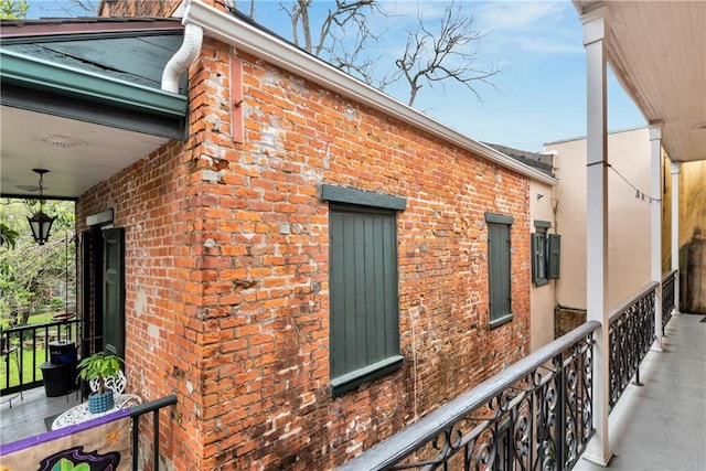 view of side of home with brick siding