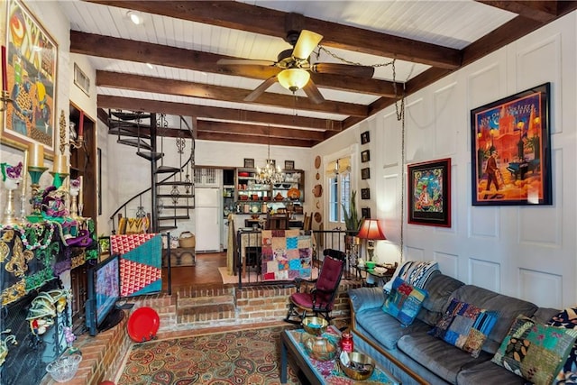 living room with beamed ceiling, visible vents, stairs, and ceiling fan with notable chandelier