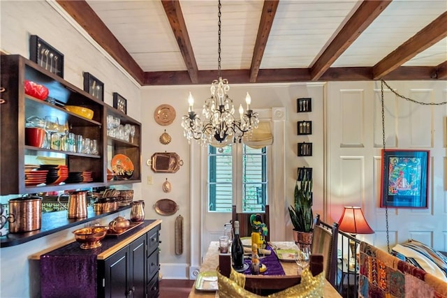 dining area featuring beamed ceiling and an inviting chandelier