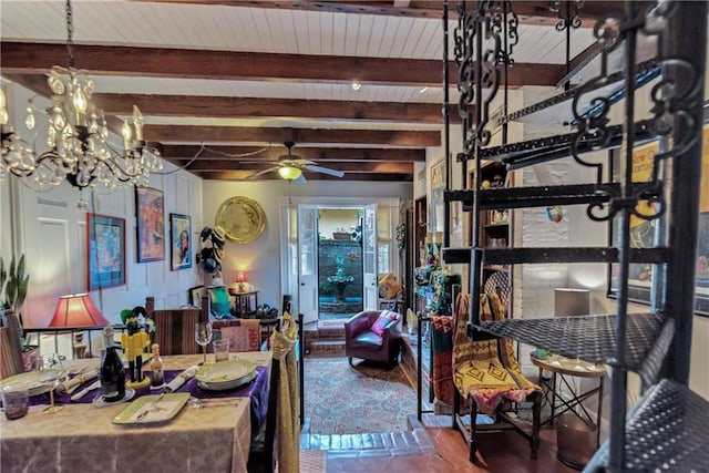 dining area featuring beamed ceiling and ceiling fan with notable chandelier